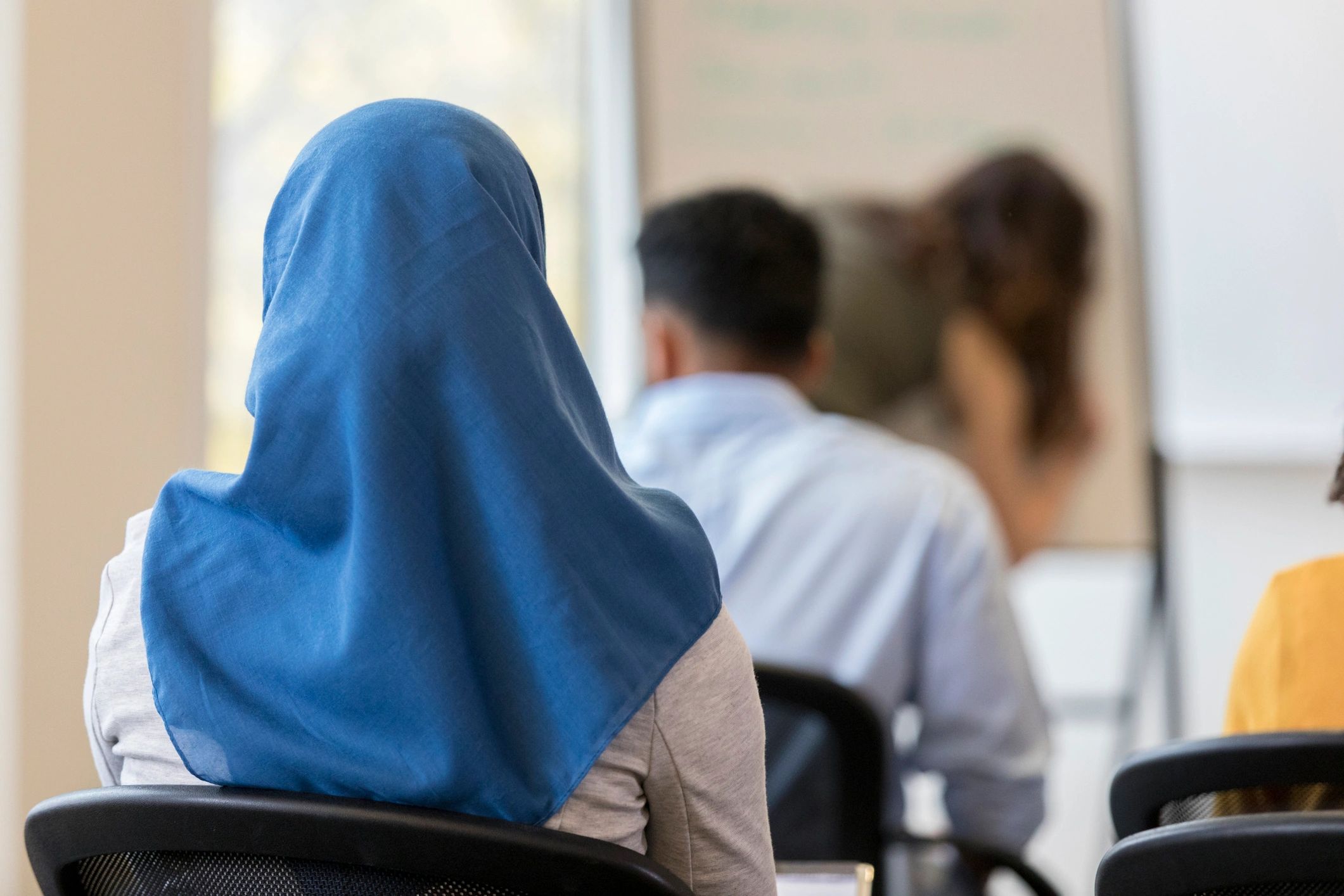Indian Muslim girls in hijab attending class, representing empowerment and education